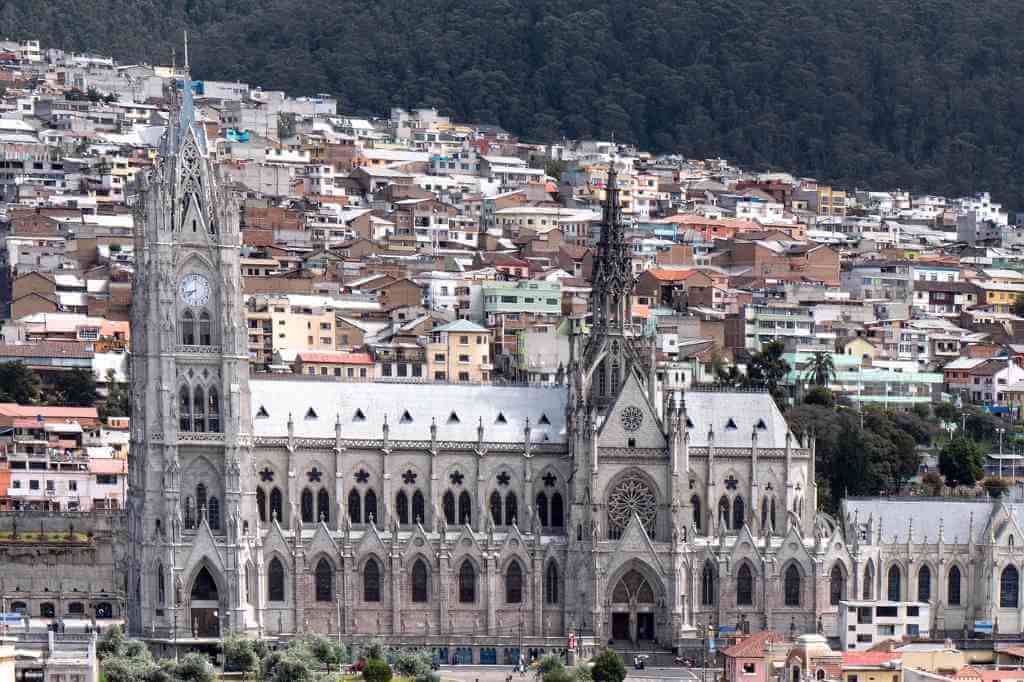 A view from a high vantage point in Quito, highlighting the cityscape and surrounding mountains.