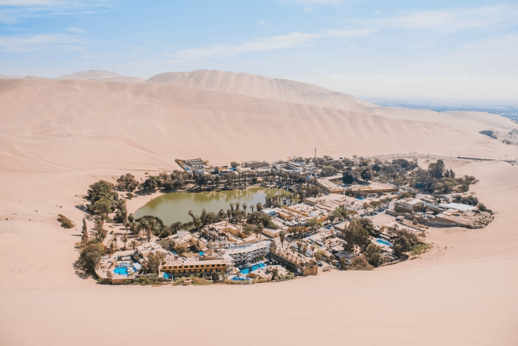The breathtaking landscape of Huacachina Oasis, perfect for sandboarding