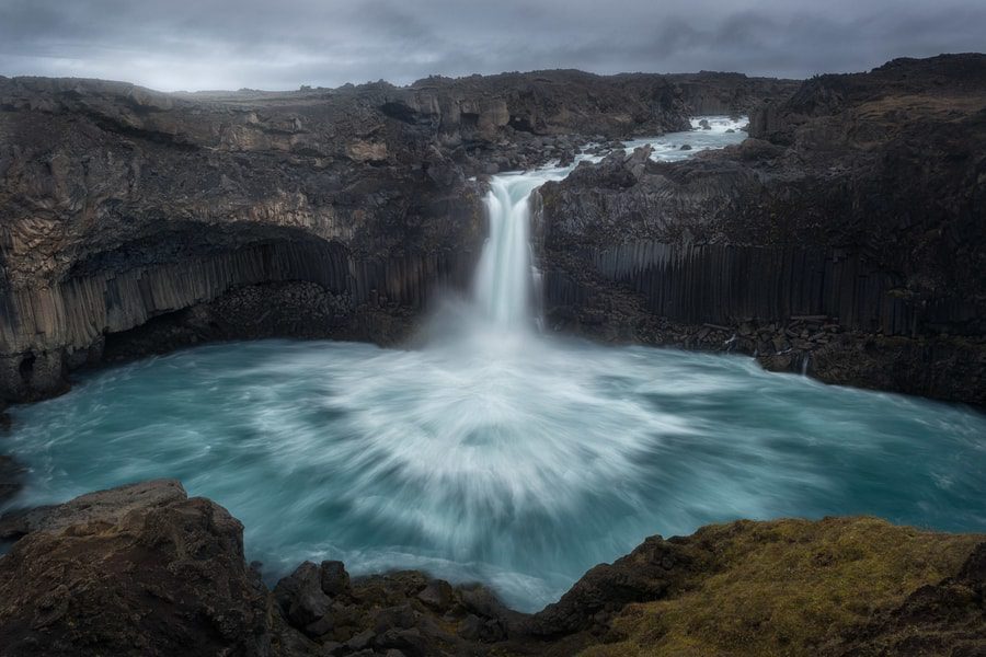 An adventurous traveler exploring the rugged terrain of Iceland's Highlands
