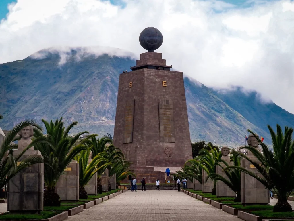 Mitad del Mundo monument in Quito, where visitors can stand on the equator line.