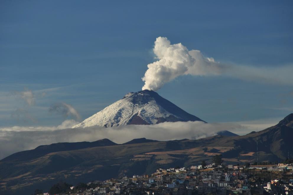 The silhouette of Pichincha volcano against the Quito skyline.